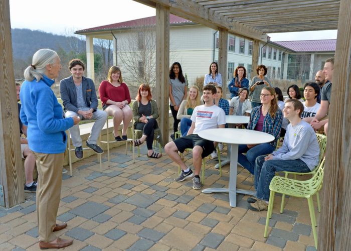 Students gathered on patio listening to Jane Goodall lecture